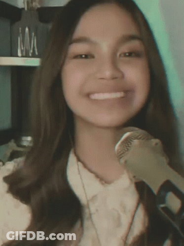 Girl Smiling Holding Microphone GIF