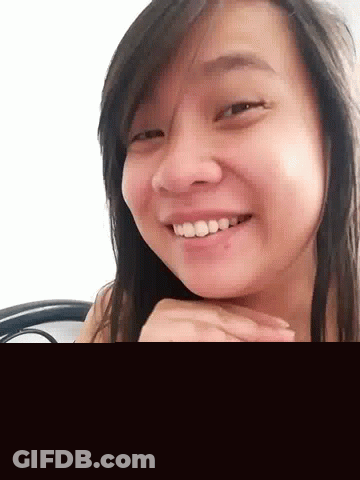 Girl Smiling With Hand On Face GIF