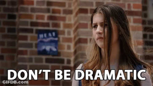 Girl Standing Before Brick Wall With Dnt Be Dramatic GIF