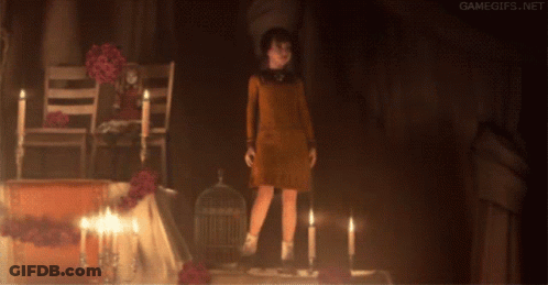 Girl Standing In Dark Room With Candles GIF