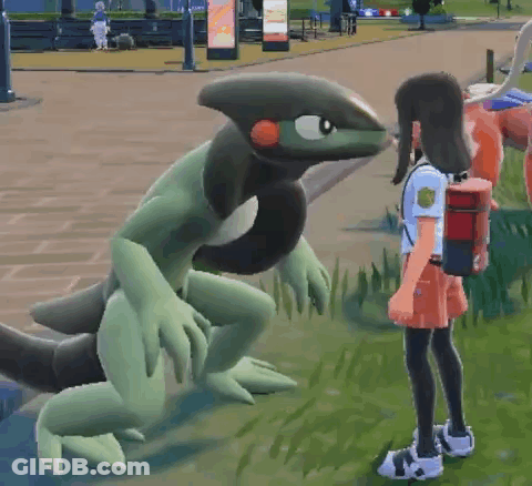 Girl Standing In Front Of Green And Black Monster GIF
