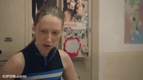 Girl Standing In Front Of Locker With Scoop Poster GIF