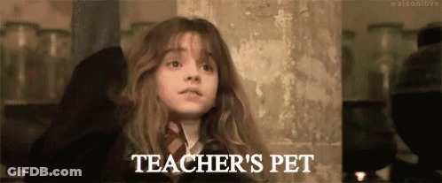 Girl Standing In Front Of Teacher's Pet Wall GIF