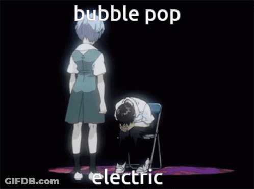 Girl Standing Next To Boy Sitting With Head On Hands GIF