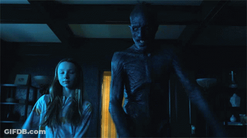 Girl Standing Next To Skeleton Monster GIF