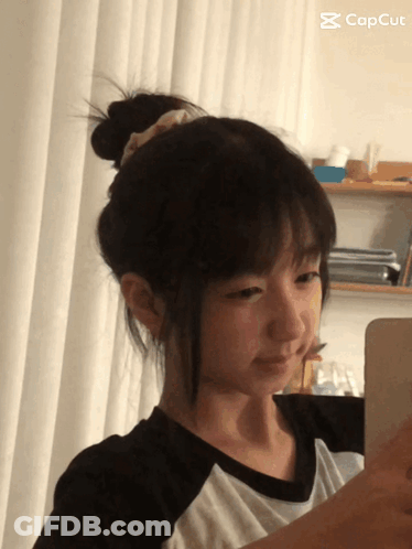 Girl Taking Selfie With CapCut Logo GIF