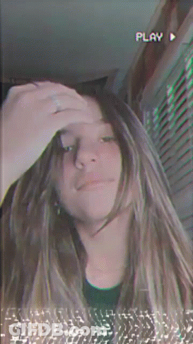 Girl Taking Selfie With Play Button GIF