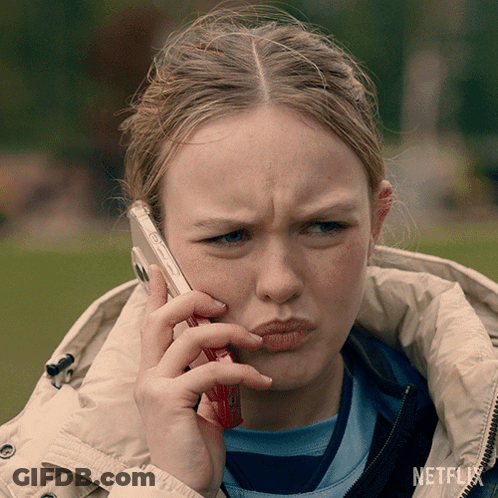 Girl Talking On Cell Phone With Netflix GIF