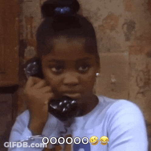 Girl Talking On Phone With Bun Saying 000000 GIF