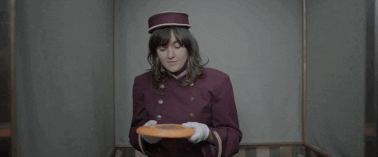 Girl Throws Frisbee Through Window GIF