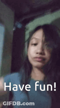 Girl Waving Saying Have Fun GIF