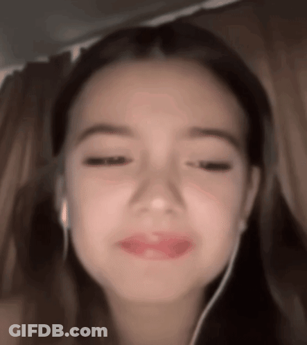 Girl Wearing Headphones Making Funny Face GIF