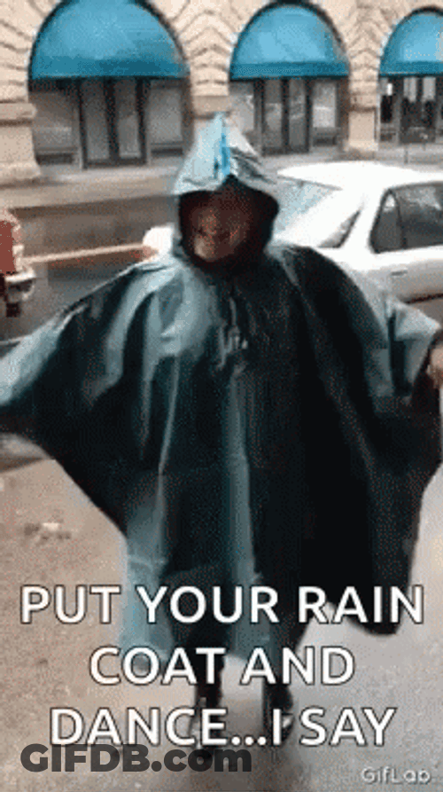 Girl Wearing Her Coat Dancing In The Rain GIF