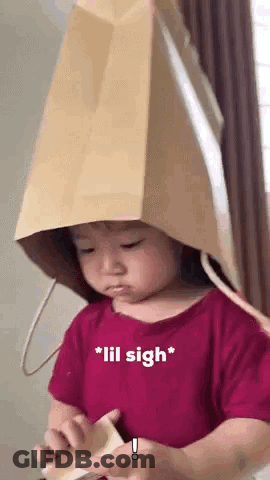 Girl Wearing Paper Bag Hat GIF