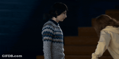 Girl With Arms Outstretched In Gym GIF