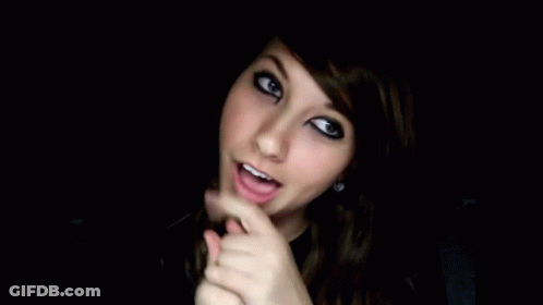 Girl With Black Eyeshadow Funny Face In Dark GIF