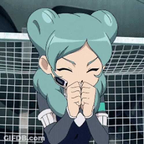 Girl With Blue Hair Covering Mouth In Front Of Soccer Net GIF
