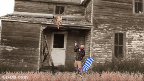 Girl With Blue Hair In Front Of Bardic Necdic Store GIF