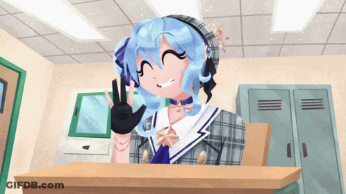 Girl With Blue Hair Sitting At Desk GIF