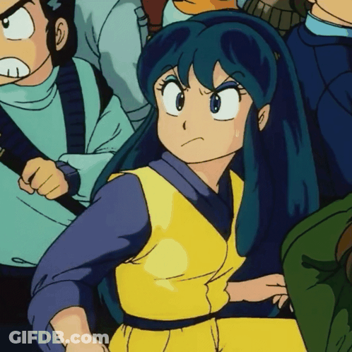 Girl With Blue Hair Sitting In Crowd GIF