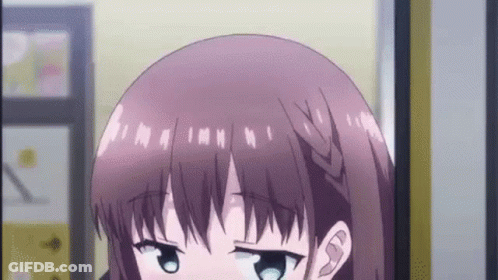 Girl With Braided Haircut Looking At Camera GIF
