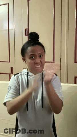Girl With Bun Making Funny Face GIF