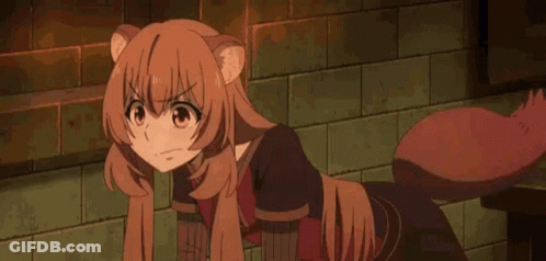 Girl With Cat Tail Sitting By Brick Wall GIF