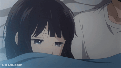 Girl With Cross On Forehead Laying Next To Man GIF