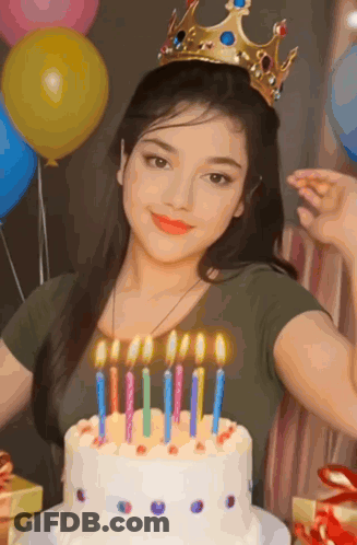 Girl With Crown In Front Of Birthday Cake GIF
