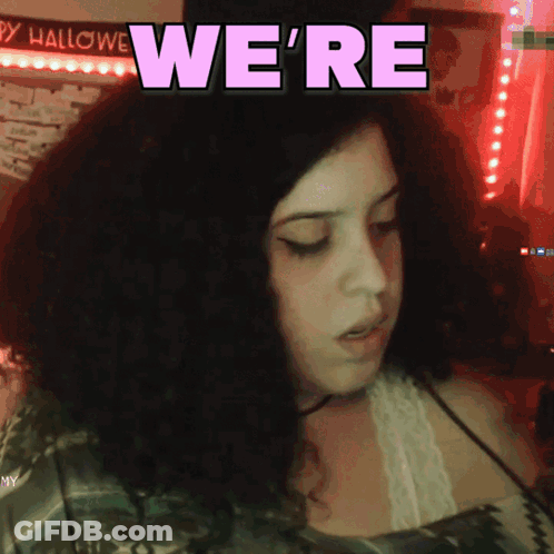 Girl With Curly Hair Says We're In Purple Letters GIF