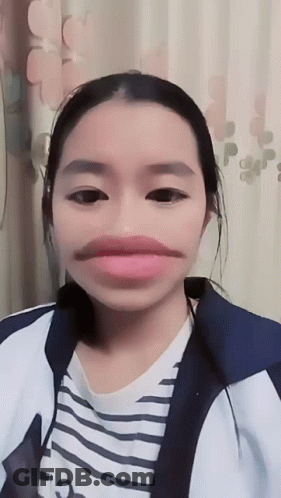Girl With Fake Mustache And Striped Shirt GIF