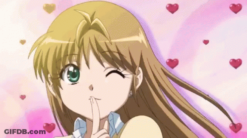 Girl With Finger On Lips Surrounded By Hearts GIF