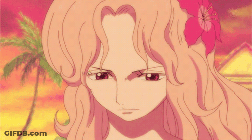 Girl With Flower In Hair Looking At Camera GIF