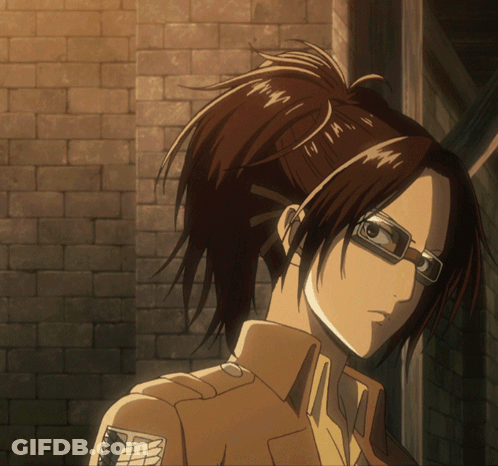 Girl With Glasses And Ponytail Standing In Front Of Wall GIF