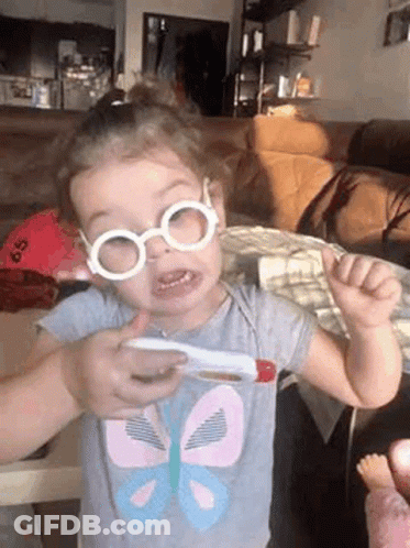 Girl With Glasses Holding Thermometer GIF