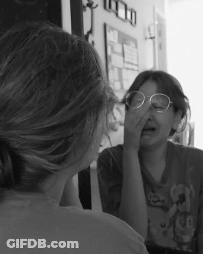 Girl With Glasses In Mirror GIF