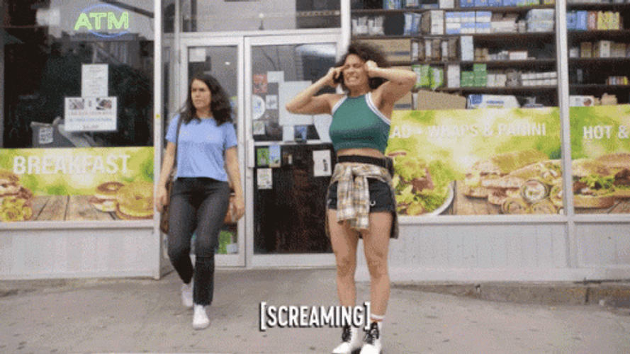 Girl With Green Top Screaming Yelling GIF