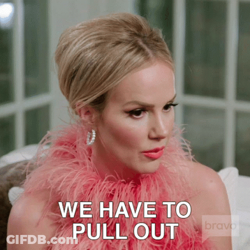 Girl With Hair Buns In Front Of Netflix Sign GIF