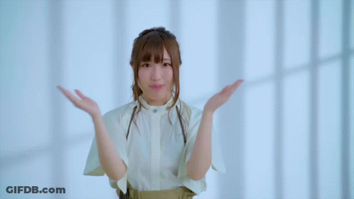 Girl With Hands On Face Looking At Camera GIF