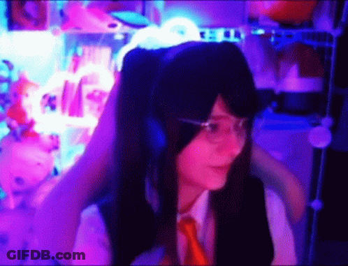 Girl With Headphones And Glasses In Purple Lights GIF