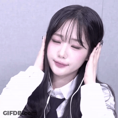 Girl With Headphones Eyes Closed Hands On Ears GIF