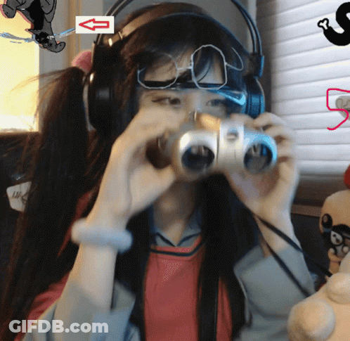 Girl With Headphones Looking Through Binoculars Arrow Left GIF