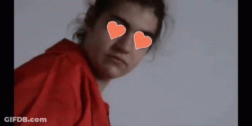 Girl With Hearts In Eyes And Pixel Heart GIF
