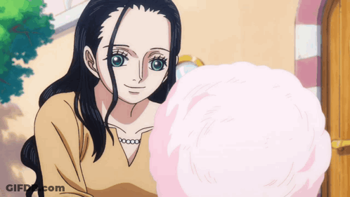 Girl With Long Black Hair Holding Pink Cotton Candy GIF