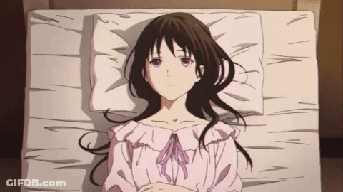 Girl With Long Black Hair Lying On Bed GIF