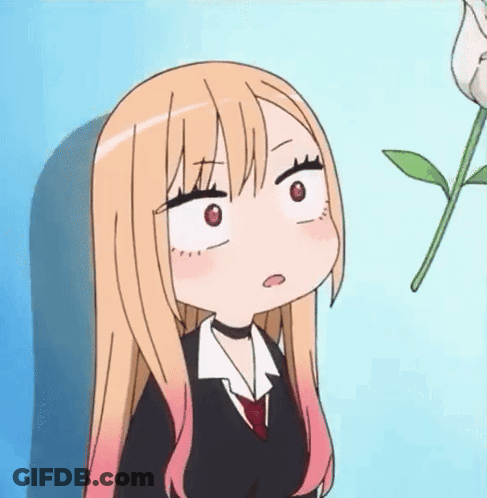 Girl With Long Blonde Hair Making Funny Face Next To Plant GIF