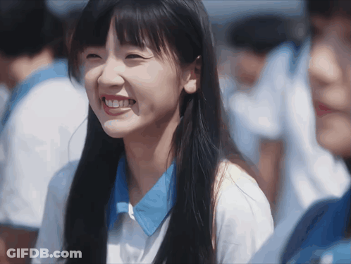 Girl With Long Hair And Blue Shirt Smiling GIF