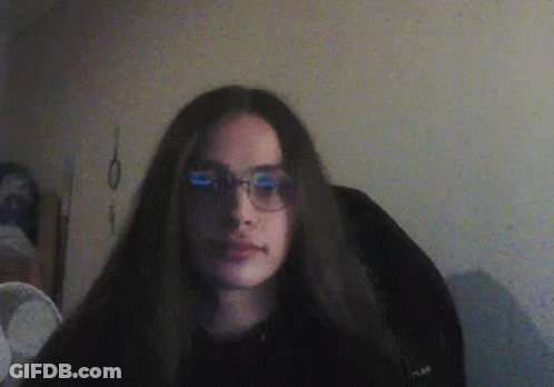 Girl With Long Hair And Glasses In Black Shirt GIF