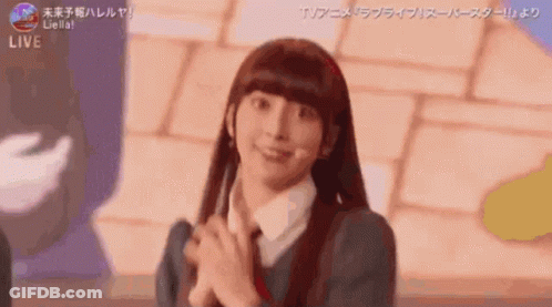 Girl With Long Hair Smiling Hands Folded GIF