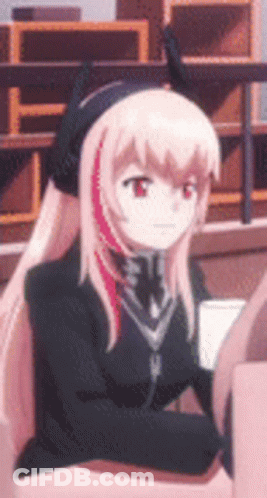 Girl With Long Pink Hair Sitting In Chair Wearing Headphones GIF